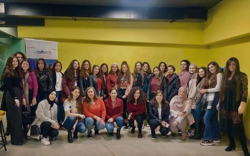 women posed for a picture at tech conference