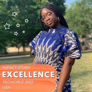 Excellence poses while standing in a field