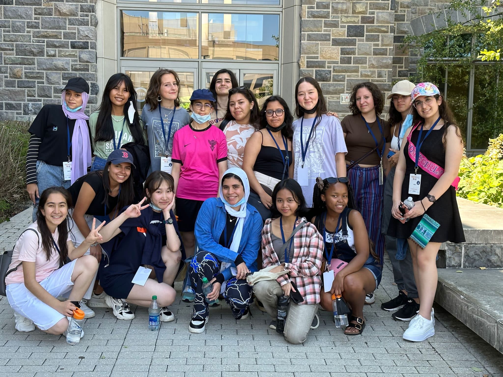 Group of TechGirls in front of a Virginia Tech building