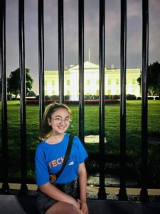 TechGirl alumna Medine smiling in front of the White House.