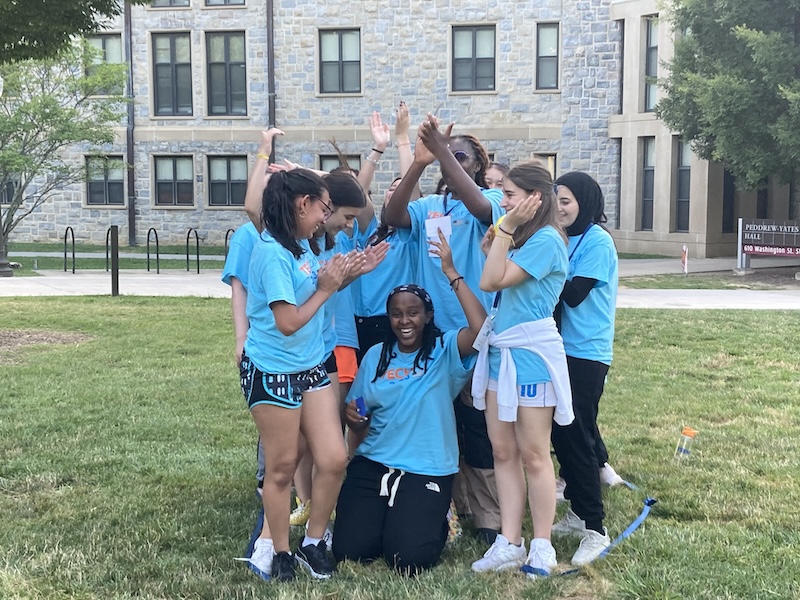 Group of TechGirls cheering each other on during an activity.