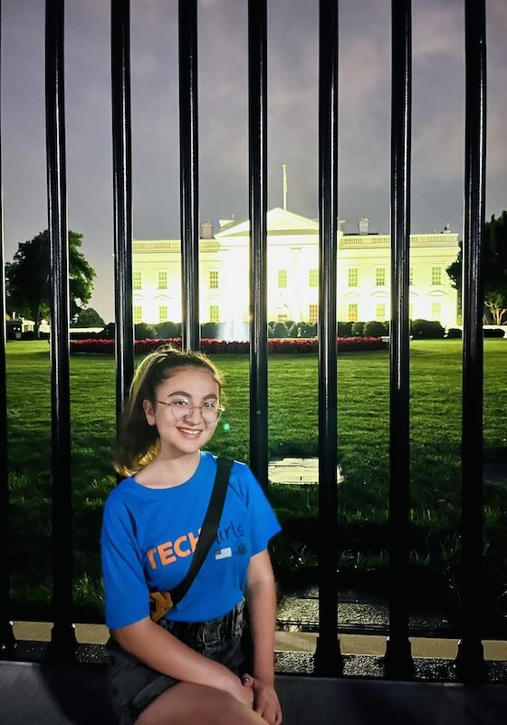 TechGirl alumna Medine smiling in front of the White House.